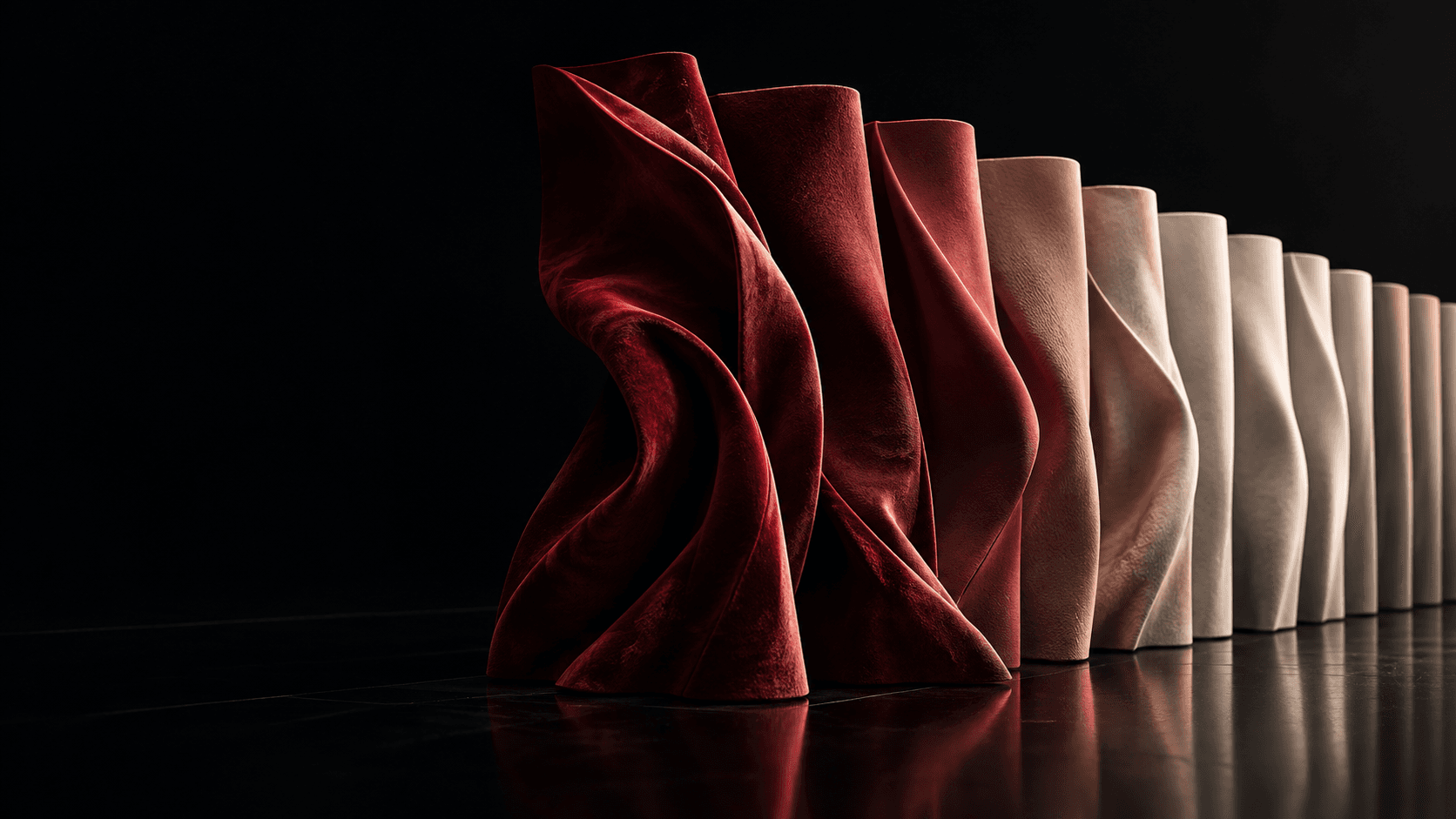 Expressive oxblood couture material resolves into increasingly uniform warm-neutral forms.