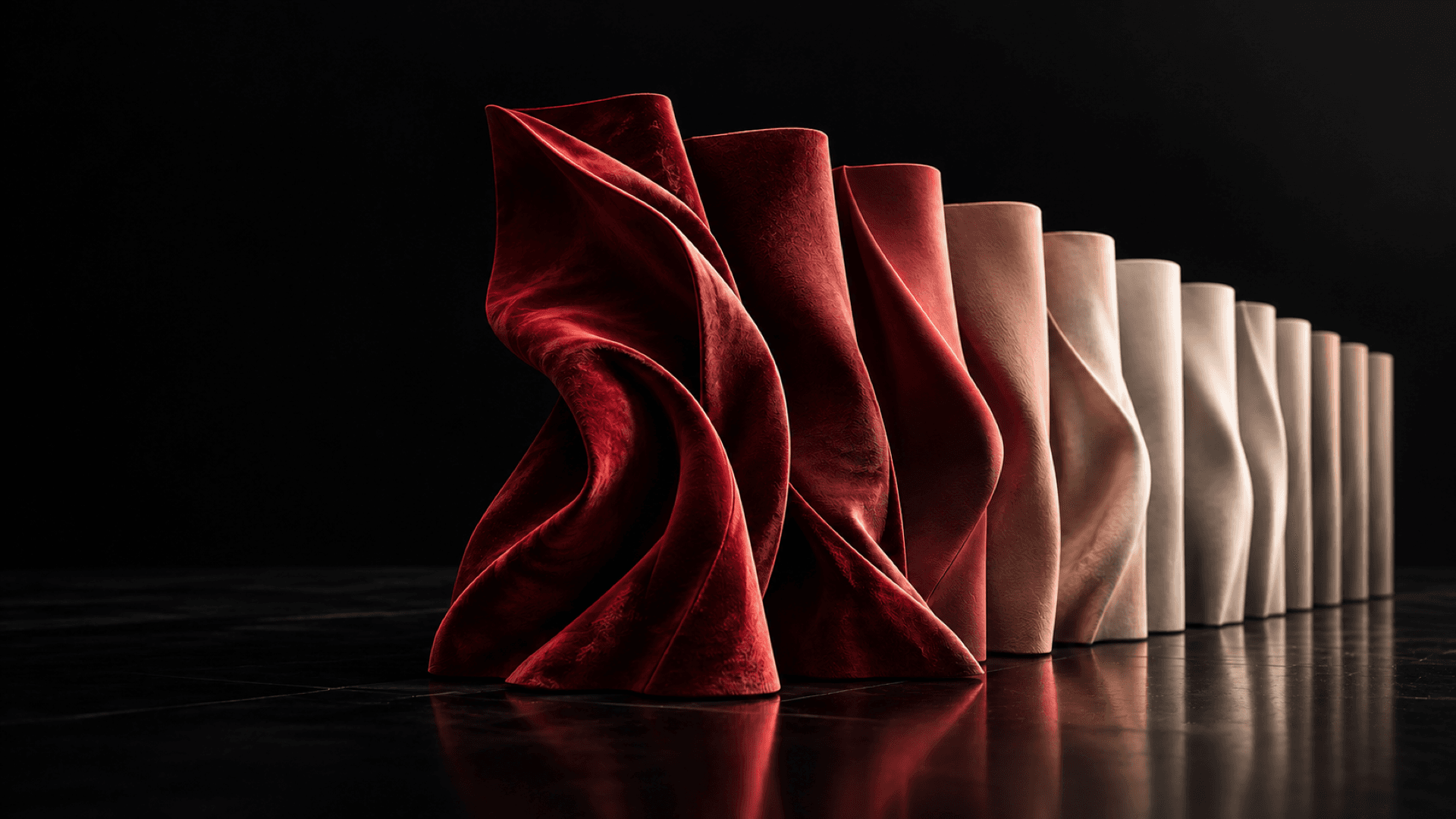 Expressive oxblood couture forms gradually converge into uniform warm-neutral material forms.